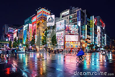 Neon lights and billboard advertisements on buildings at Akihabara at rainy night, Tokyo, Japan Editorial Stock Photo