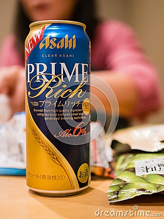 Close-up of Asahi prime rich beer can with Japanese snack Editorial Stock Photo