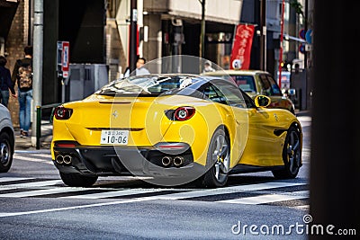 Tokyo, Japan, 26 October 2023: Rear View of a Yellow Sports Car on a Busy Tokyo Street Editorial Stock Photo