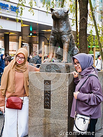 Tourists taking pictures with Hachiko Memorial statue Editorial Stock Photo
