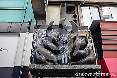 Tokyo, Japan, 26 October 2023: Unique Sculpture Above a Tokyo Shop Entrance Editorial Stock Photo