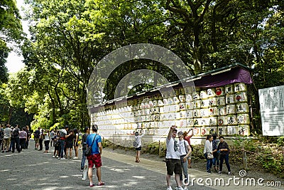 Barrels of sake nihonshu donated to the Meiji Shrine, located in Shibuya, Tokyo Editorial Stock Photo