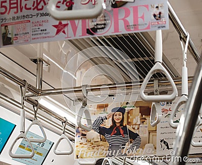 Tokyo, Japan - Satomi Ishihara, Japanese actress in Tokyo Metro campaign banner. Editorial Stock Photo