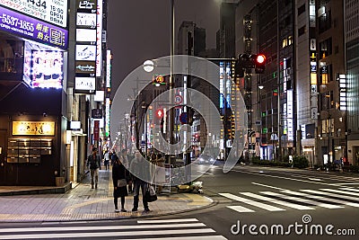 Tokyo, Japan, 04/08/2017: Street of a modern night metropolis with illumination Editorial Stock Photo