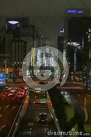 Tokyo, Japan, 04/08/2017: Street of a modern night metropolis with illumination. Editorial Stock Photo