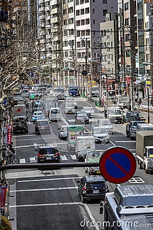 Tokyo, Japan, 04/12/2019: Traffic cars on the streets. Vertical Editorial Stock Photo