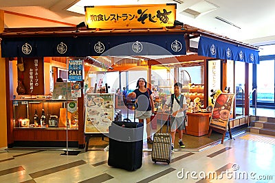 Tokyo: Narita airport before immigration check in retail area. Editorial Stock Photo