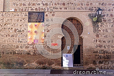 Toledan Mudejar style arch with wooden entry doors to the Museum of the Councils and Visigoth Culture, Spain. Editorial Stock Photo