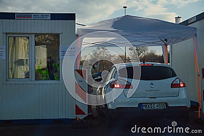 Toll Booth with Coronavirus Health Inspector and Car Editorial Stock Photo