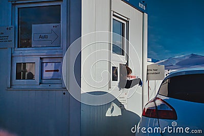 Toll Booth Worker Leaning Out of Window Editorial Stock Photo