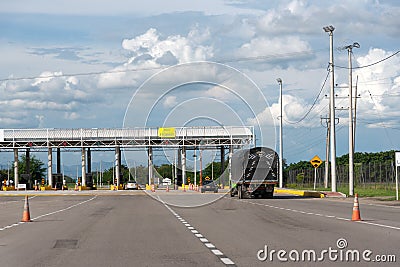 Toll on a Colombian highway on a sunny day. Editorial Stock Photo