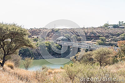 Toll house and old bridge over the Vaal River Stock Photo