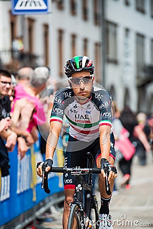 Tolmezzo, Italy May 20, 2018: Fabio Aru, UAE Team, visibly worried moves from the bus to the podium signatures Editorial Stock Photo