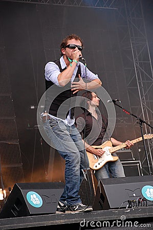 Tom Barman and Mauro Pawlowski singing and playing violin live with the Deus band at Pohoda Festival, Trencin, Slovakia - July 8, Editorial Stock Photo