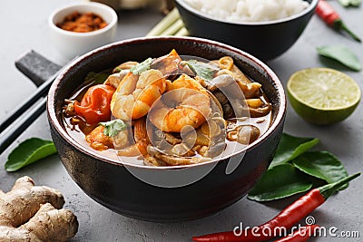 Tom Yam Kung - spicy Thai soup with shrimps. Served with rice Stock Photo