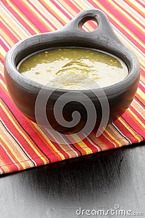 Tomatillo sauce in colombian clay dish Stock Photo