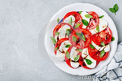 Tomato, basil, mozzarella Caprese salad with balsamic vinegar and olive oil Stock Photo