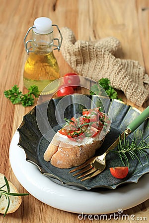 Bruschetta, Crusty Italian Appetizers, Bruschetta Slices of Toasted Baguette with Tomato, Basil, and Olive Oil Stock Photo