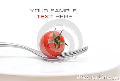 Tomato cherry on fork. Diet Stock Photo