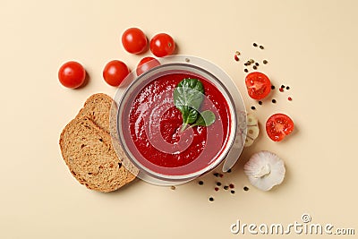 Tomato cream soup on beige background Stock Photo