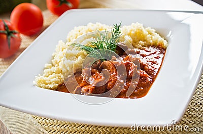 Tomato curry with couscous Stock Photo