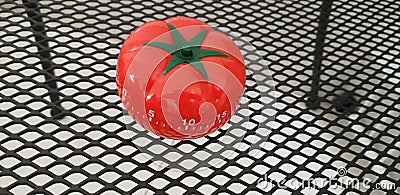 Pomodoro timer - mechanical tomato shaped kitchen timer for cooking or studying Stock Photo