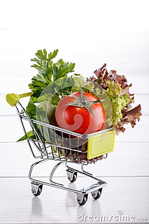 Vegetables on shopping trolley Stock Photo