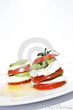 Tomato mozzarella salad with avocado Stock Photo