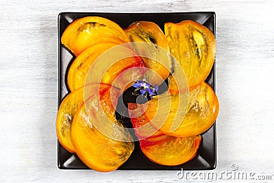 Tomato salad Pineapple sliced in a square plate. Stock Photo