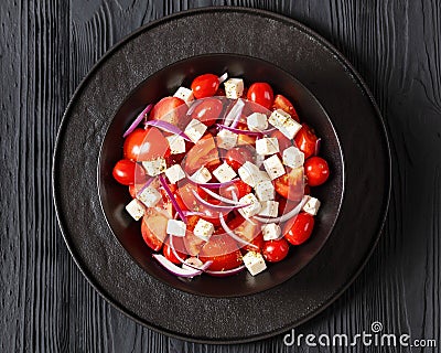 tomato salad with red onion and white cheese Stock Photo