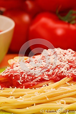 Tomato sauce spaghetti dish with parmiggiano cheese. Stock Photo