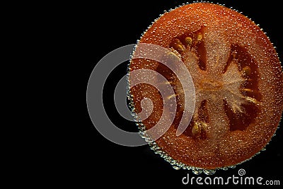 Tomato slice with bubbles Stock Photo