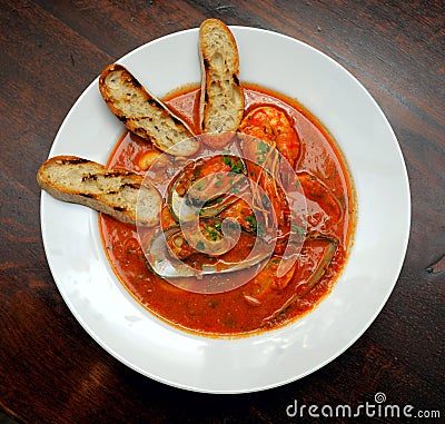 Tomato soup with seafood and toasts Stock Photo