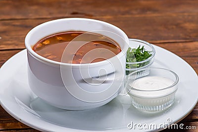 Tomato soup in a white bowl Stock Photo