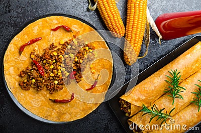 Tomato tortilla with spicy meat mixture Stock Photo