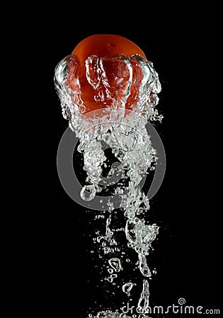 Tomato in water Stock Photo