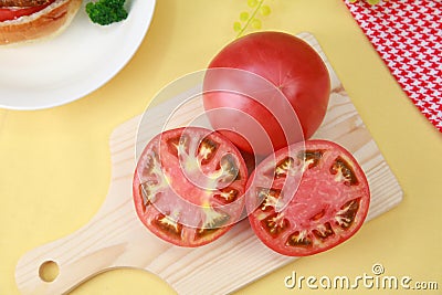 The tomato which I cut on the cutting board. Stock Photo