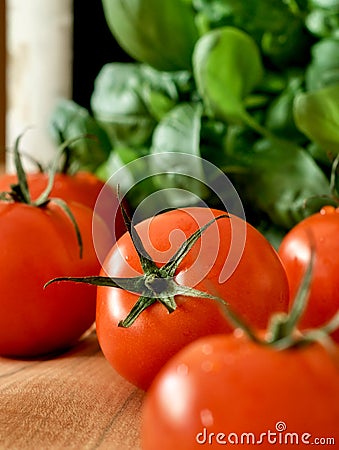 Tomatoes, basil and a bottle of wine Stock Photo