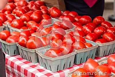 Tomatoes In Baskets At Farmers Market Stock Photo