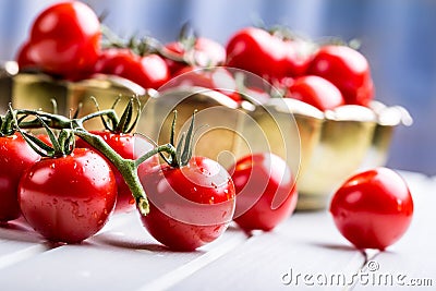 Tomatoes. Cherry tomatoes. Cocktail tomatoes. Fresh grape tomatoes carafe with olive oil Stock Photo