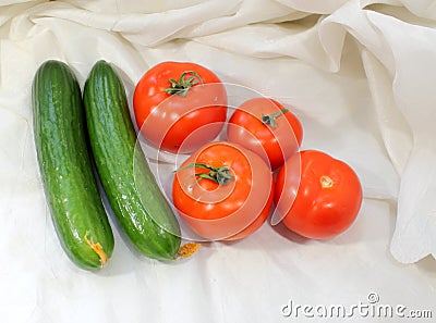 Tomatoes and cucumbers Stock Photo