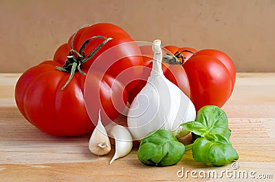 Tomatoes, garlic and basil Stock Photo