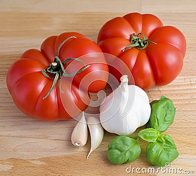 Tomatoes, garlic and basil Stock Photo