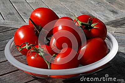 Tomatoes on a glass plate Stock Photo