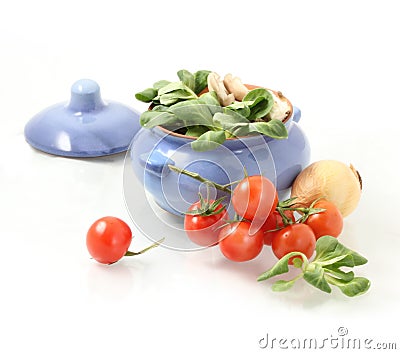 tomatoes, herbs and pot Stock Photo