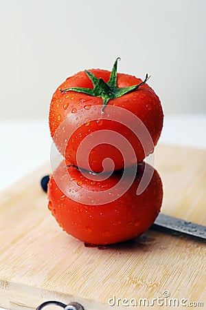 Tomatoes and knife Stock Photo