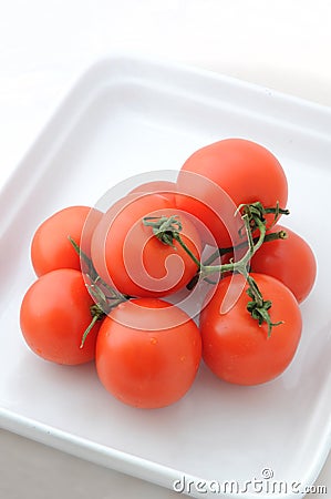 Tomatoes On A Plate Stock Photo