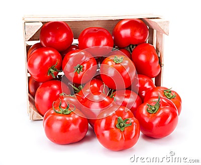 Tomatoes (Solanum lycopersicum) in wooden crate Stock Photo