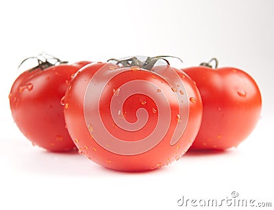 Tomatoes sprinkled with water Stock Photo