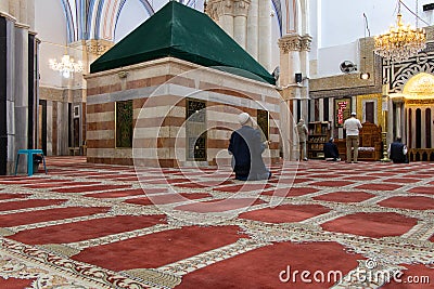 Tomb of Rebecca in Hebron - Palestine. April 21, 2022. Muslim visitors praying in Abraham Mosque of Hebron. Editorial Stock Photo